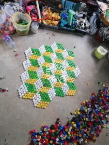 Plastic bottle cap tiles. Work in Progress 2018 Cambodia By Nina Clayton & Louise Wauters